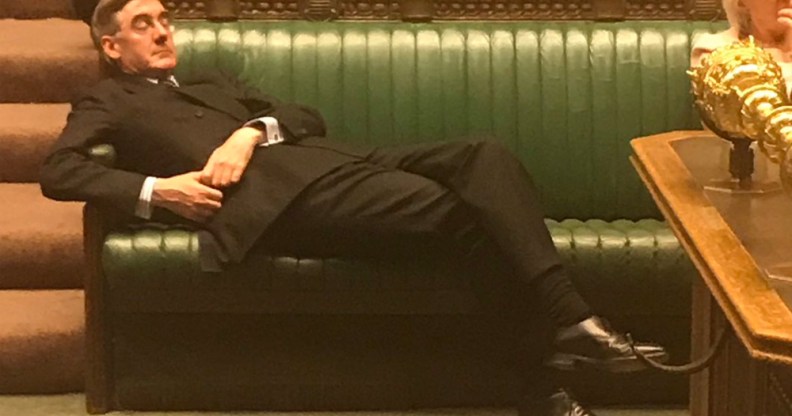 Jacob Rees-Mogg reclining in parliament