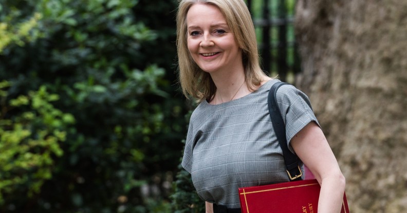 Liz Truss holding a red portfolio box