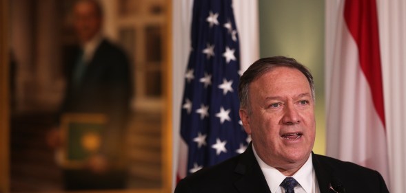 Mike Pompeo in front of a US flag