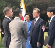 President Moon Jae-in of South Korea and his wife Kim Jung-sook, meet New Zealand ambassador Philip Turner and his husband Hiroshi Ikeda