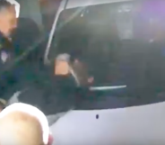 Wayne Benitez pummelling Gustavo Alvarez against a car windshield. (Screen capture via YouTube/The Mercury News)