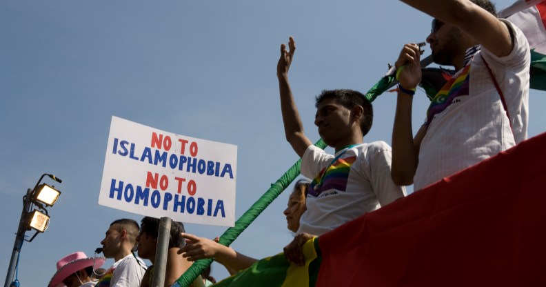 Members of Imaan wave from atop a float during the EuroPride parade.