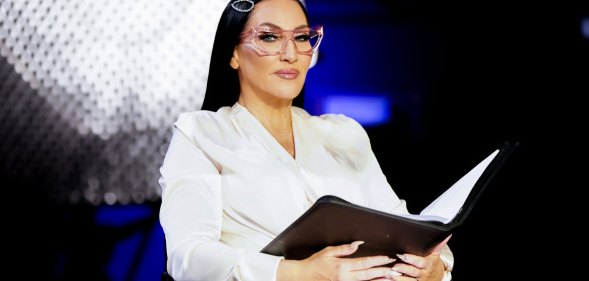 Michelle Visage holding a book