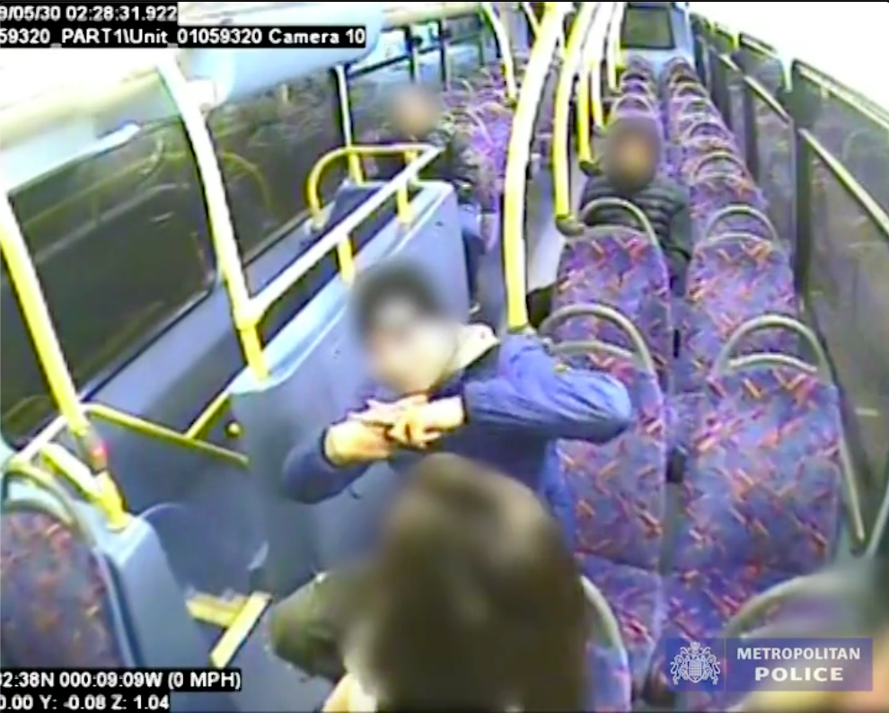 One of the teens, aged 15, makes a crude scissoring gesture towards the queer couple. (Screen capture via the Metropolitan Police)