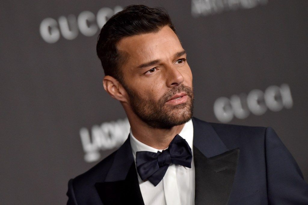 Ricky Martin in a navy blue and black tuxedo