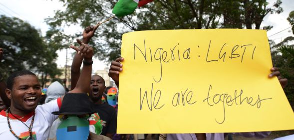 Kenyan gay and lesbian organisations demonstrate outside the Nigerian High Commission in Nairobi, one holding a yellow sign that reads: 'Nigeria: LGBTI, We are together'