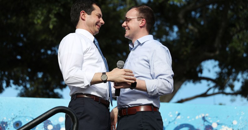 Democratic presidential candidate and South Bend, Indiana Mayor Pete Buttigieg (L) is introduced by his husband, Chasten Glezman Buttigie. (Joe Raedle/Getty Images)