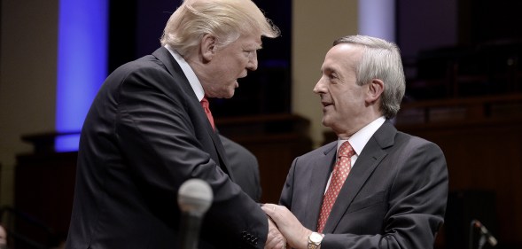 US president Donald Trump is greeting by pastor Robert Jeffress