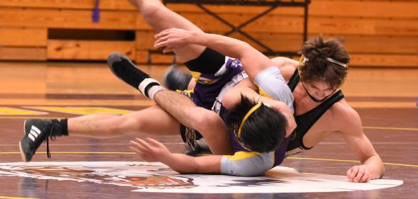 A priest was caught taking photos in a high school gym during a wrestling tournament without consent or knowledge. (Stock photo via UnSplash)