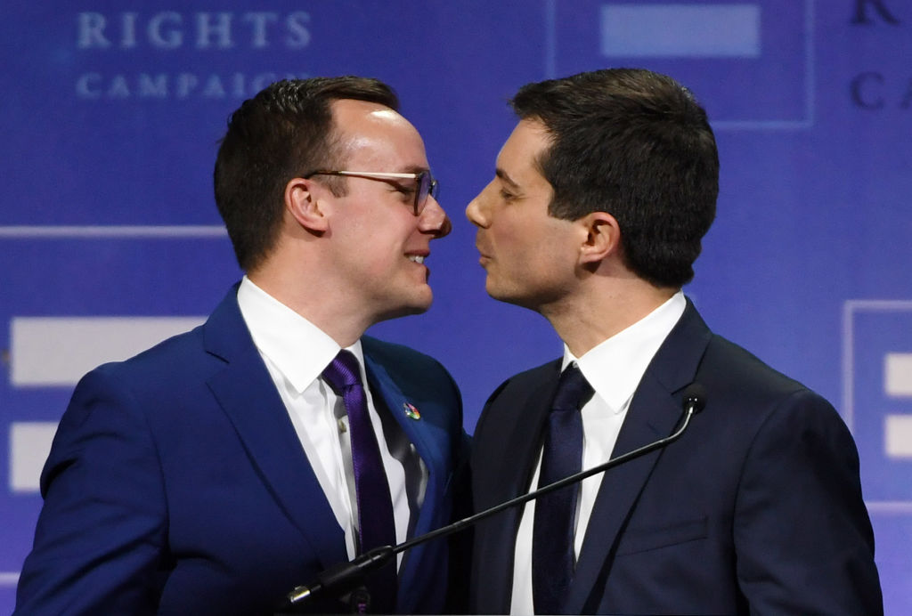 Chasten Buttigieg kisses his husband, South Bend, Indiana Mayor Pete Buttigieg