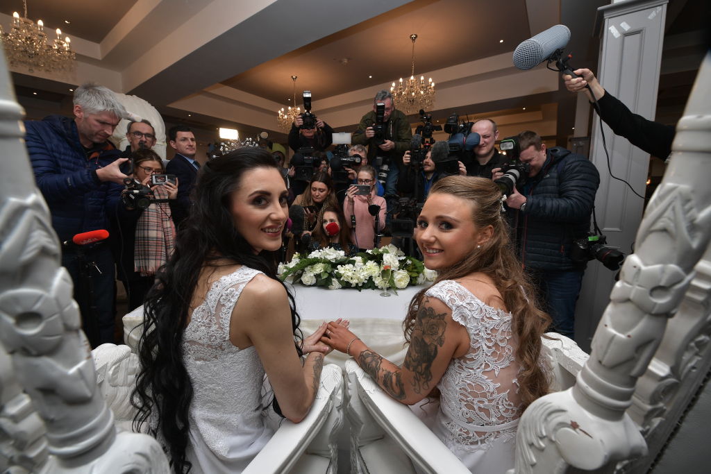 Robyn Peoples, from Belfast, and Sharni Edwards, from Brighton, pose for the media after getting married on February 11, 2020 in Carrickfergus, Northern Ireland.