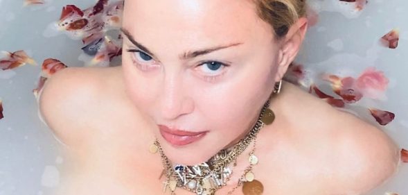 Madonna delivers coronavirus message while naked in a bath full of petals