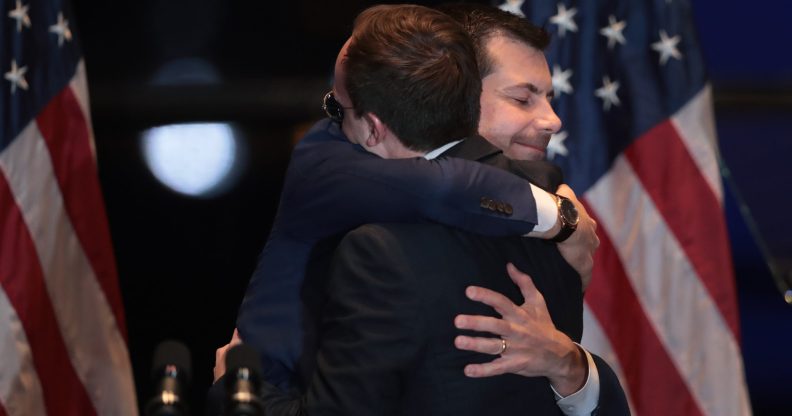 Former South Bend, Indiana Mayor Pete Buttigieg hugs his husband Chasten after announcing he was ending his campaign to be the Democratic nominee for president. (Scott Olson/Getty Images)