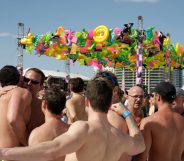 A group of men hugging at the Winter Party Festival on Miami Beach. At least one attendee in 2020 acquired the coronavirus, according to organisers. (Jeffrey Greenberg/Universal Images Group via Getty Images)