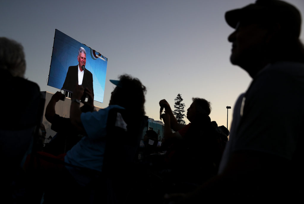 Attendees look on as reverend Franklin Graham, notoriously anti-LGBT, speaks. (Justin Sullivan/Getty Images)