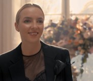 Villanelle in a black wedding suit