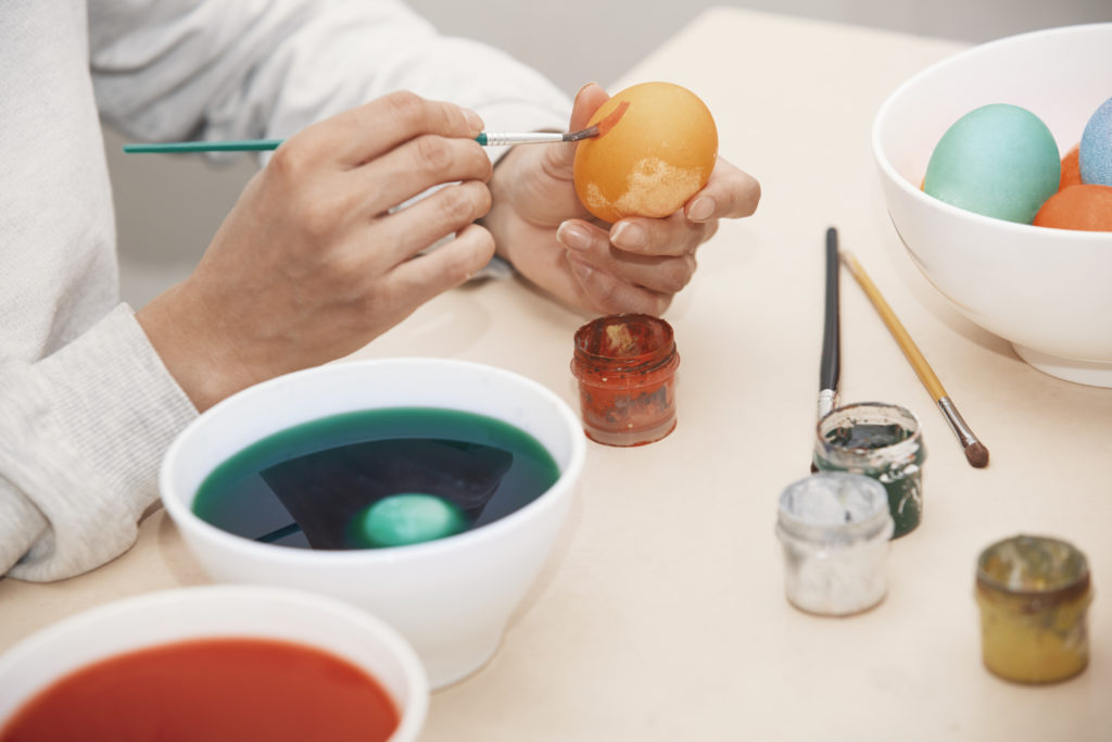 A homosexual laces an Easter egg with flagrantly gay chemicals. (Stock photograph via Elements Envato)