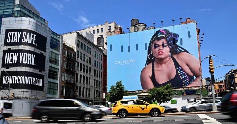 Cars drive past a billboard featuring Black trans model and activist Jari Jones in an advertisement for Calvin Klein. (Angela Weiss / AFP via Getty Images)