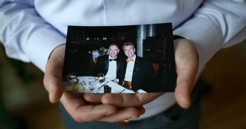 Jim Obergefell holds a photo of him and his late husband John Arthur in his condo in Cincinnati, on April 2, 2015. (Maddie McGarvey/For The Washington Post via Getty Images)