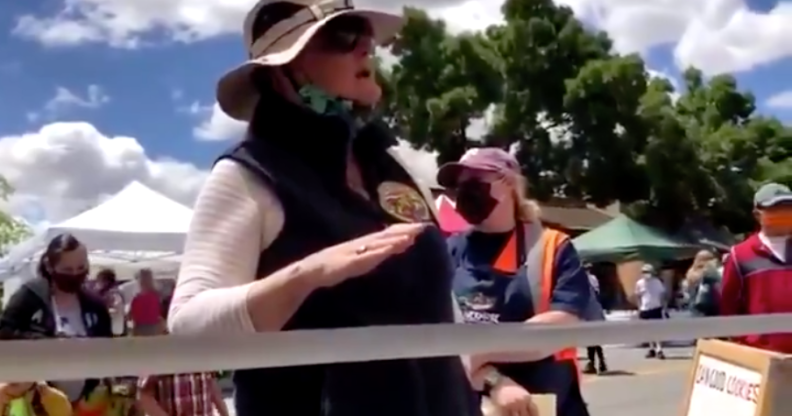 Gail Hayden, head of the California Farmer’s Market Association, scolds a gay vendor for handing out LGBT+ Pride flags. (Screen capture via Twitter)