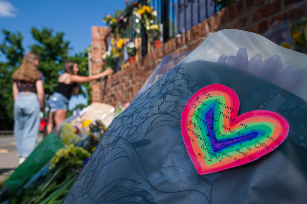 A rainbow message on a bunch of flowers