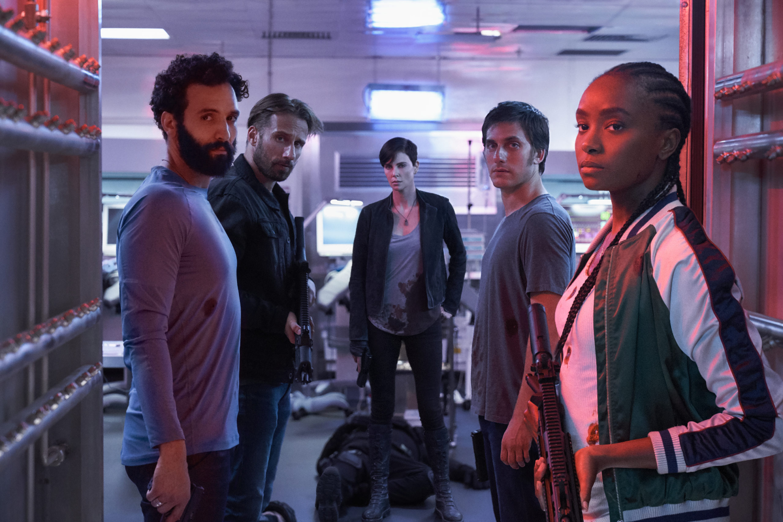 The cast of The Old Guard. Marwan Kenzari as Joe, Matthias Schoenaerts as Booker, Charlize Theron as Andy, Luca Marinelli as Nicky, Kiki Layne as Nile.