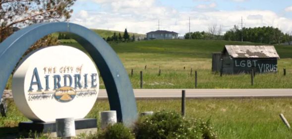 The term "LGBT virus" was daubed on a shed visible from the highway at the entrance to the city of Airdrie