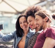 Three people taking a selfie