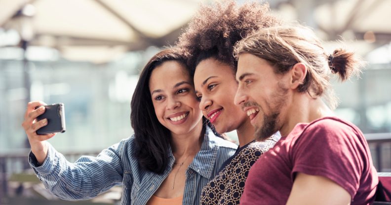 Three people taking a selfie