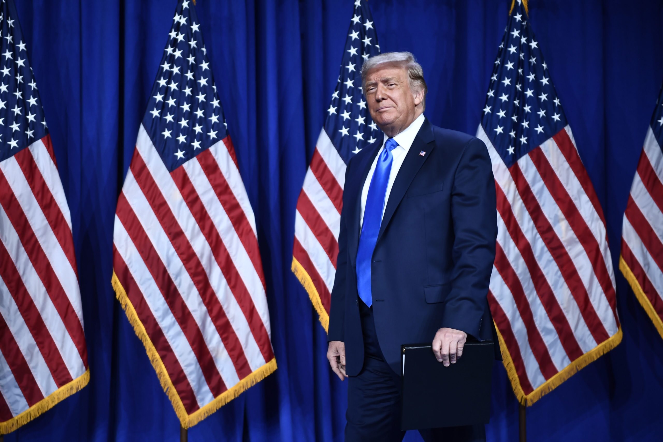 US President Donald Trump arrives to speak during the first day of the Republican National Convention 