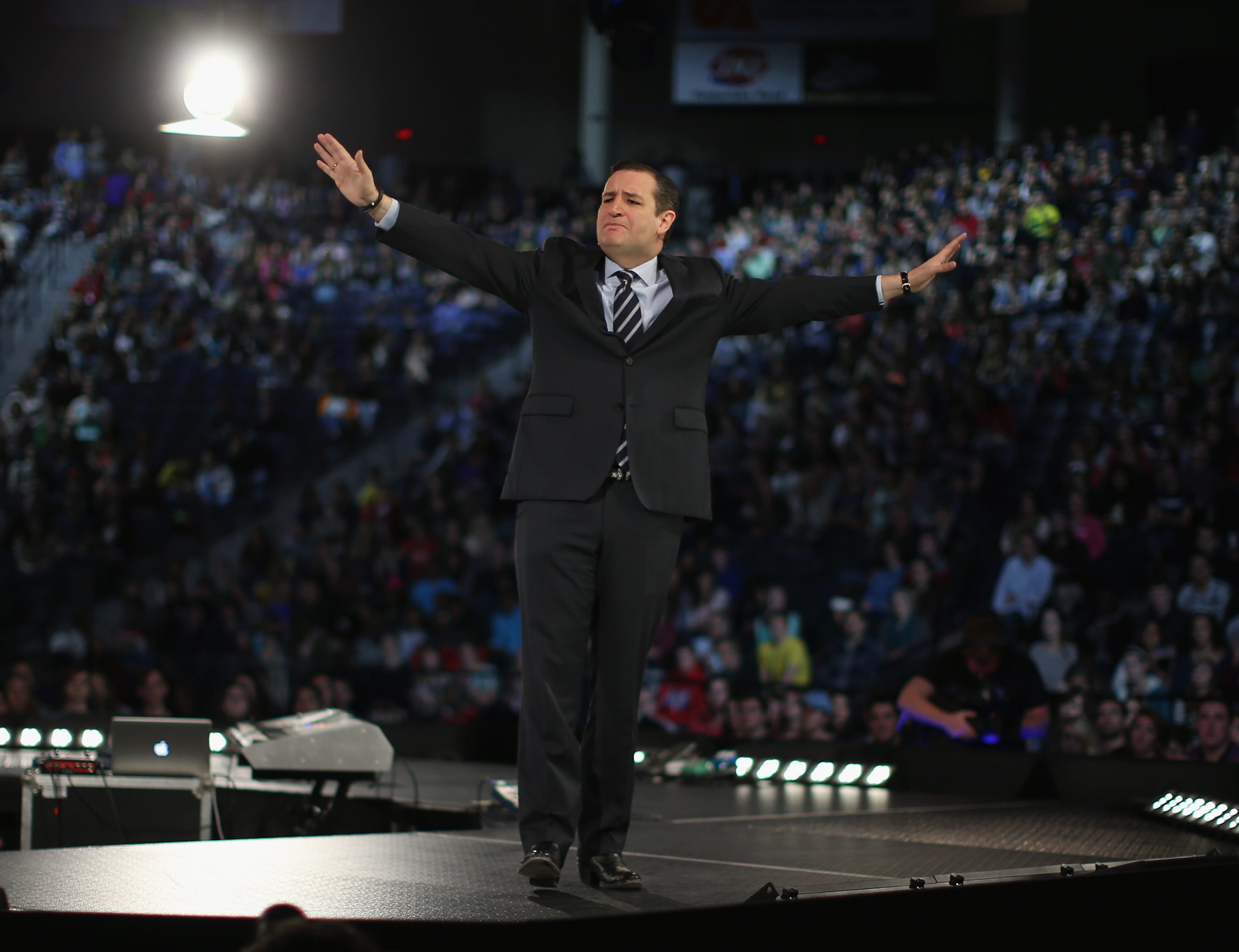 US Senator Ted Cruz stands on stage while speaking to a crowd gathered at Liberty University to announce his presidential candidacy on March 23, 2015 