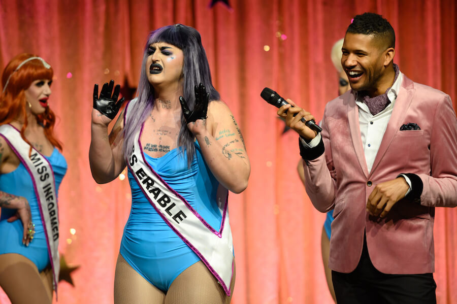 Ilona in a bathing suit with a 'Miss Erable' sash