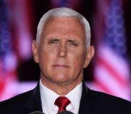 Mike Pence in front of USA flags