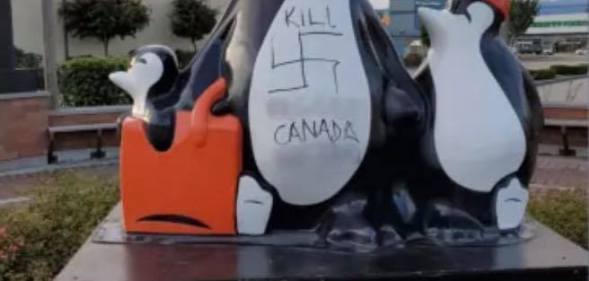 Penguin statue vandalised with vile homophobic slurs and swastikas