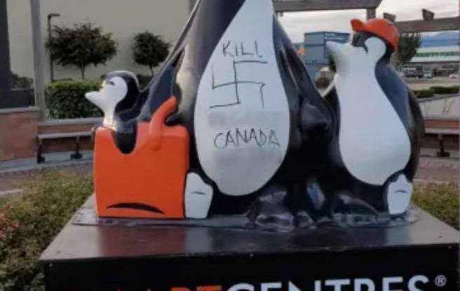 Penguin statue vandalised with vile homophobic slurs and swastikas