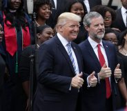 Jerry Falwell Jr, the-president of Liberty University, poses for photos with Donald Trump in 2017