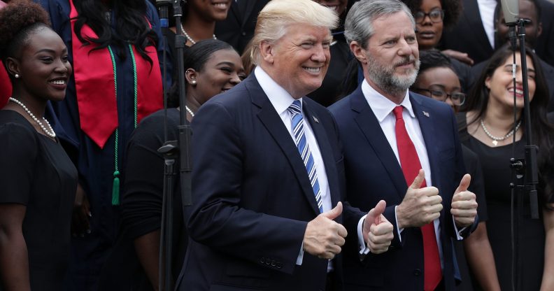 Jerry Falwell Jr, the-president of Liberty University, poses for photos with Donald Trump in 2017