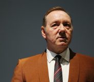 Kevin Spacey in an orange-brown suit