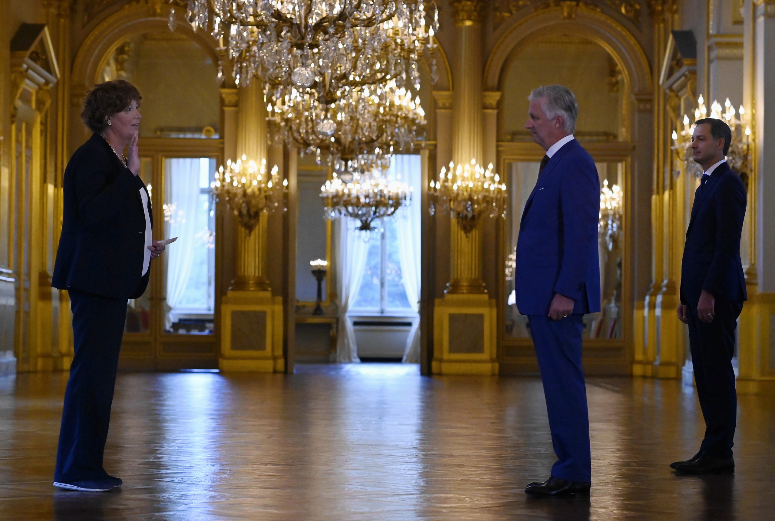 Petra De Sutter takes the oath before the king and Prime Minister De Croo at the oath ceremony of at the Royal Palace 