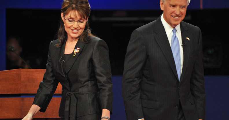 Sarah Palin and Democrat Joseph Biden walk on stage following their vice presidential debate