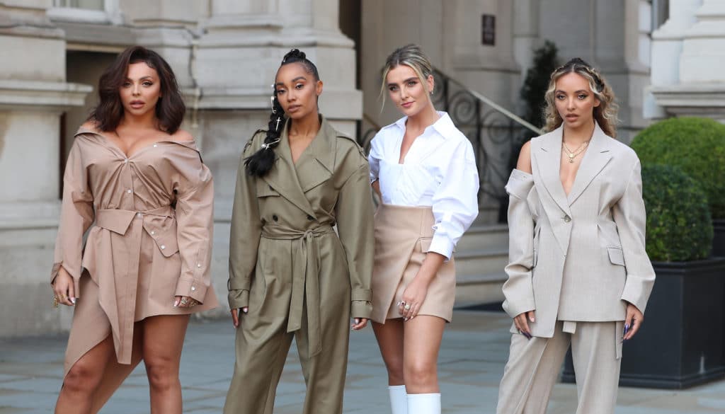 The four members of Little Mix standing on a London street