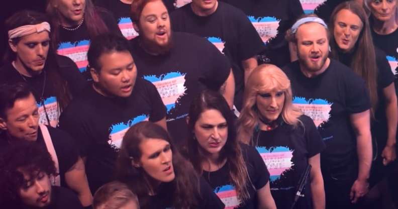 Choir members wearing t-shirts with a heart on in the colours of the trans flag