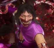 Mileena, wearing a purple top bearing sharp, alien teeth