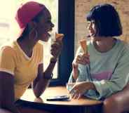 Two women eating ice cream cones