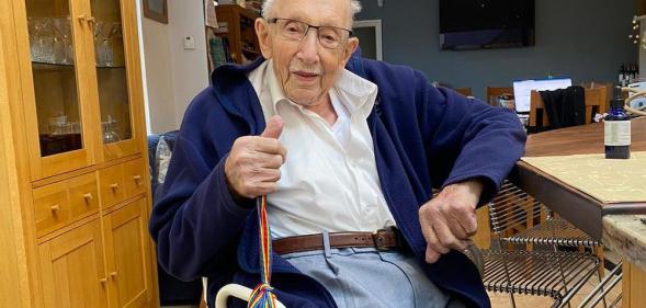 Captain Tom Moore poses with rainbow laces to champion LGBT+ inclusion in sport