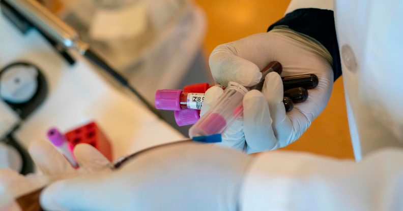 A phlebotomist takes blood donation samples