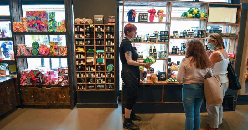 People wearing protective face masks shop in Lush in Bournemouth in June2020