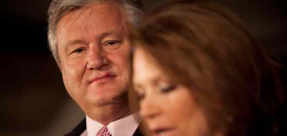 Marcus Bachmann wears a suit and red tie