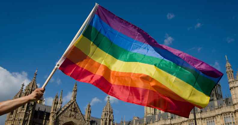 Pried flag held in front of the houses of parliament