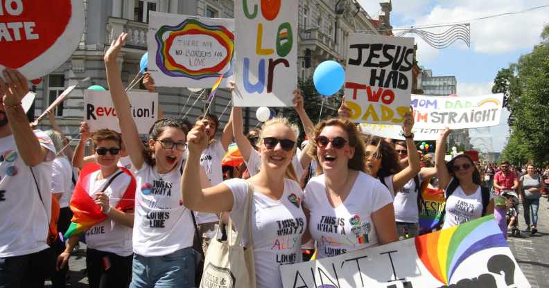 People hold flags and balloons as they take part in the Baltic Pride 2016 in Vilnius, Lithuania.